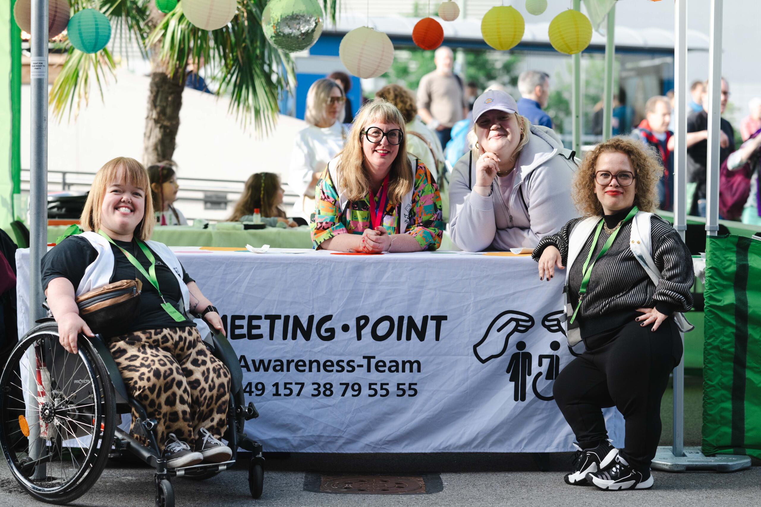 Four members of the Barrier-free Celebrations initiative at their meeting point
